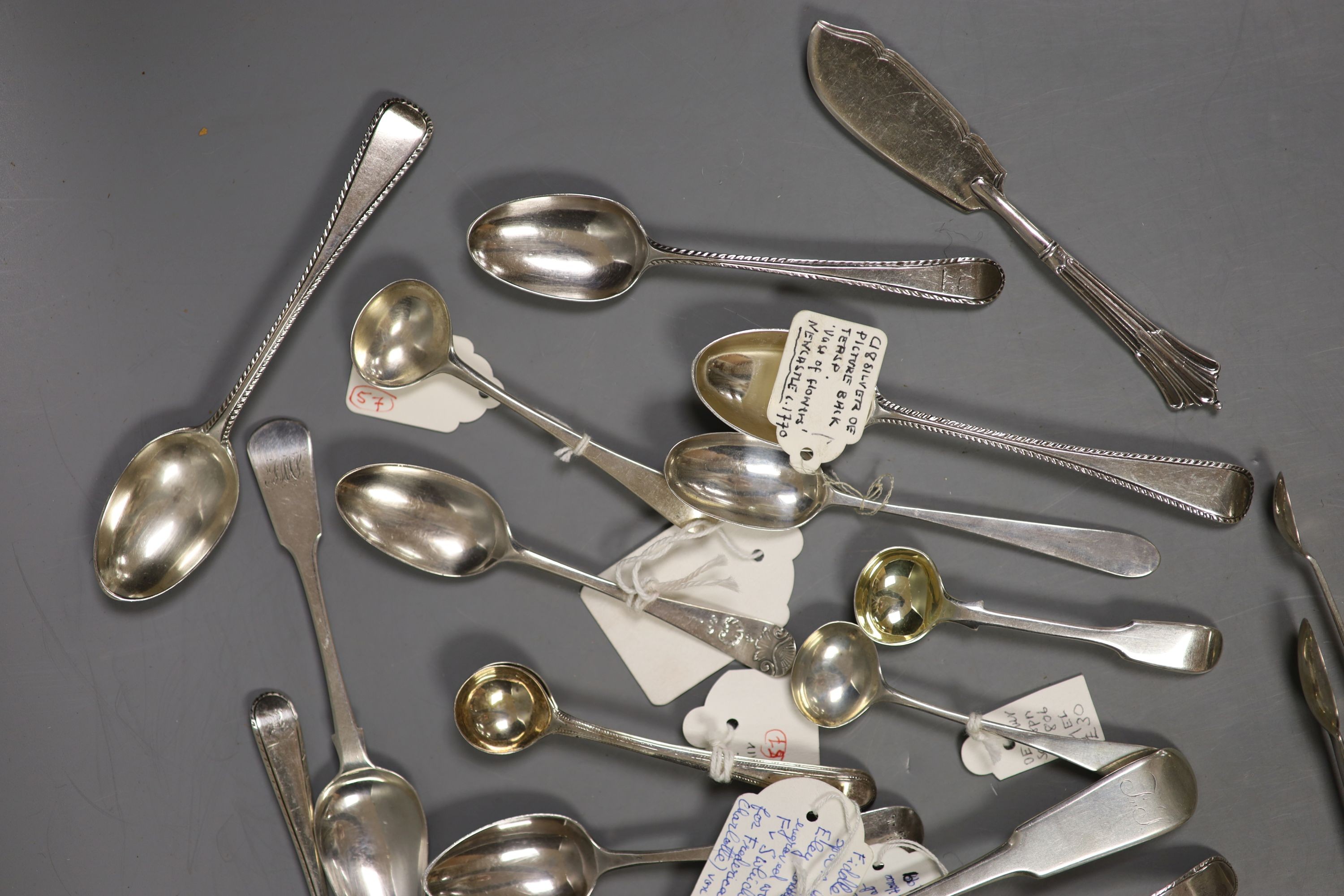 A small quantity of assorted mainly 19th century and later silver flatware including teaspoons, dessert spoon, sugar tongs, butter knife sifter spoon etc. various date and makers, 13.5oz.